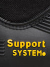 Svart och gul text som lyder "Support System" på en svart yta med söm och textur.